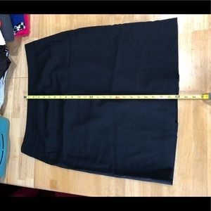 Black suit skirt with flirty back detail